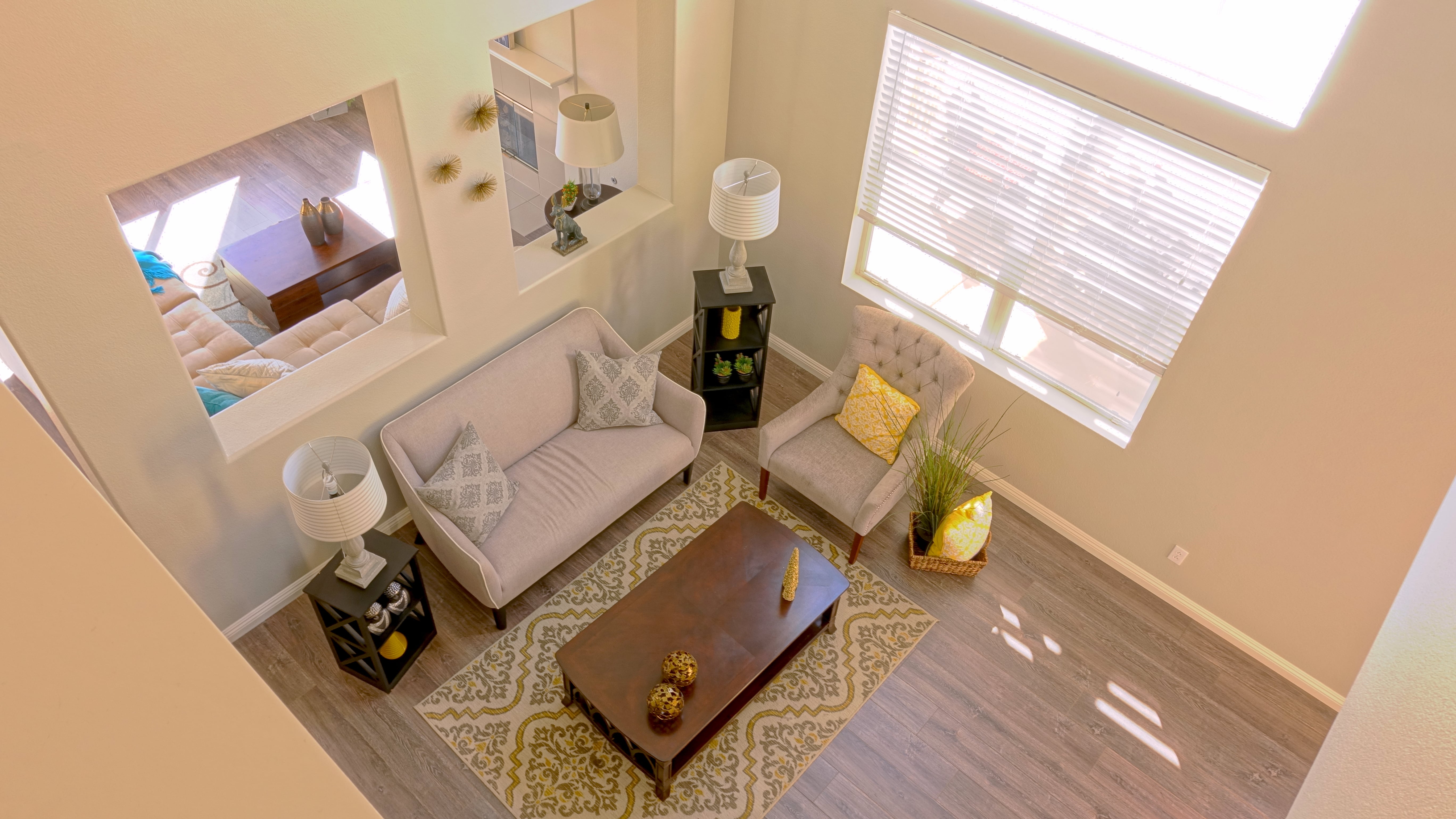 An overhead view of a cozy beige living room, similar to one you might find when you rent a home with Redwood Residential Property Management